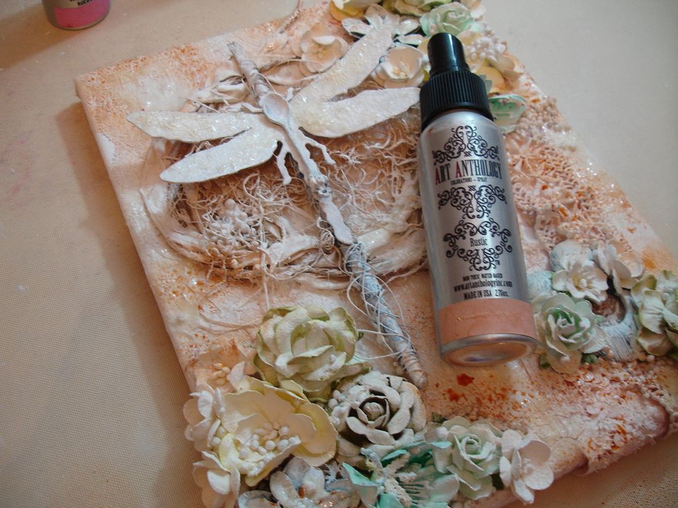 Once crackle was completely naturally dried I sprays Rustic Colorations then heat dried with my heating tool.