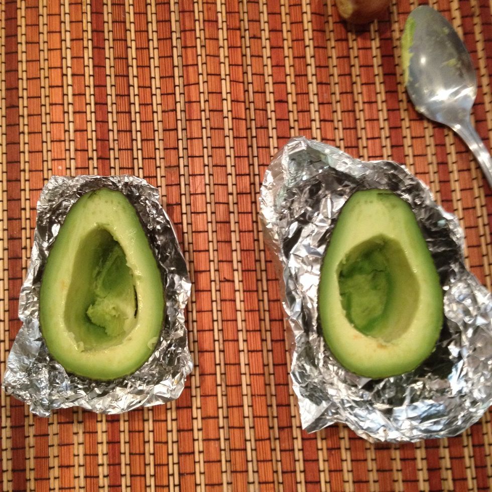 Once done place avocados in a foil bowl