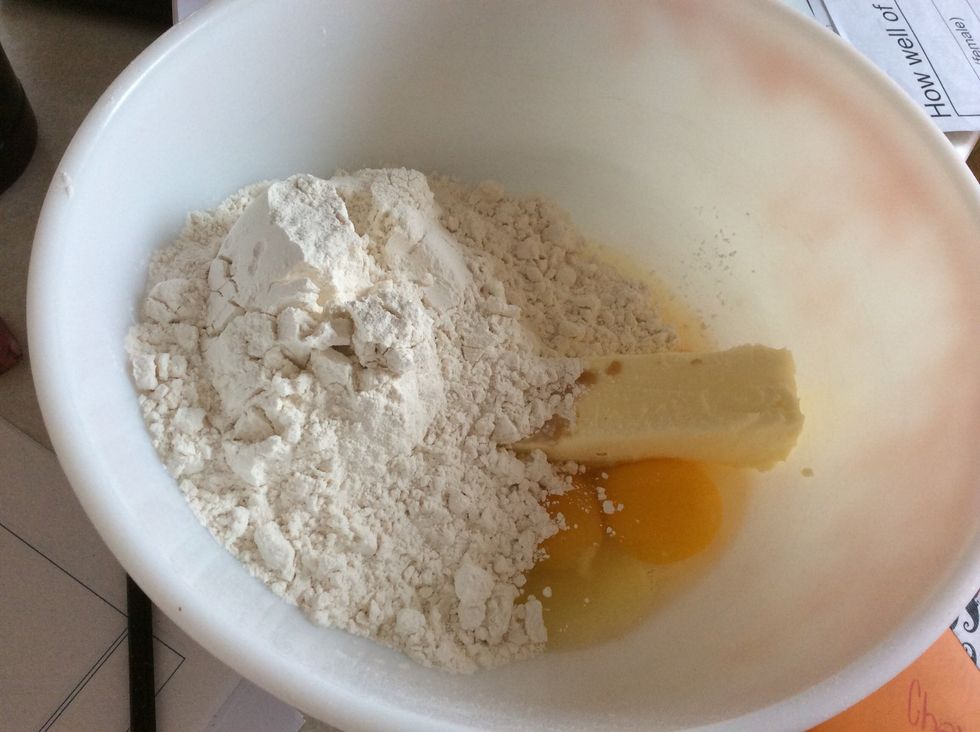 Once done with step 5, add 2 cups of sifted flour into the bowl.