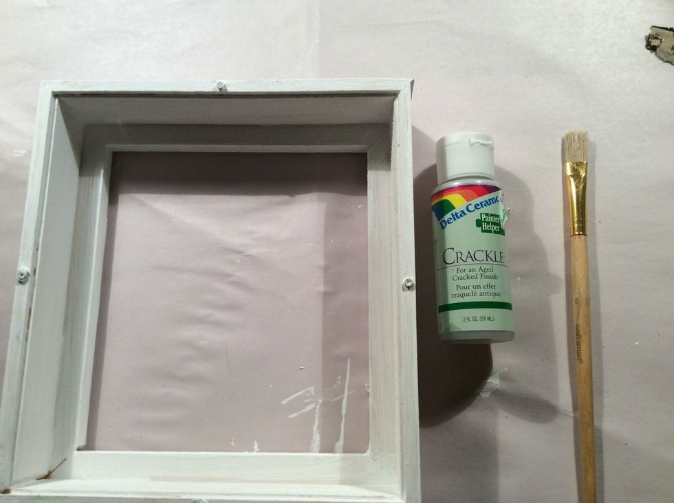 Once dry apply a nice coat of your Crackle medium of choice. Follow the directions on your bottle. Once this medium was tacky I applied another coat of white acrylic paint and cracks started forming.