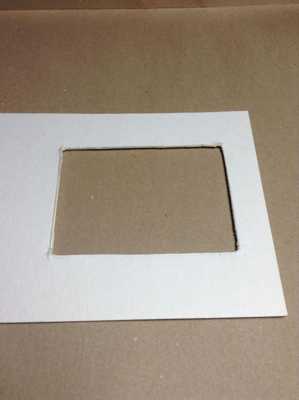 Once dry I have made a window, cutting the three pieces of chipboard that I have for to make my front cover.