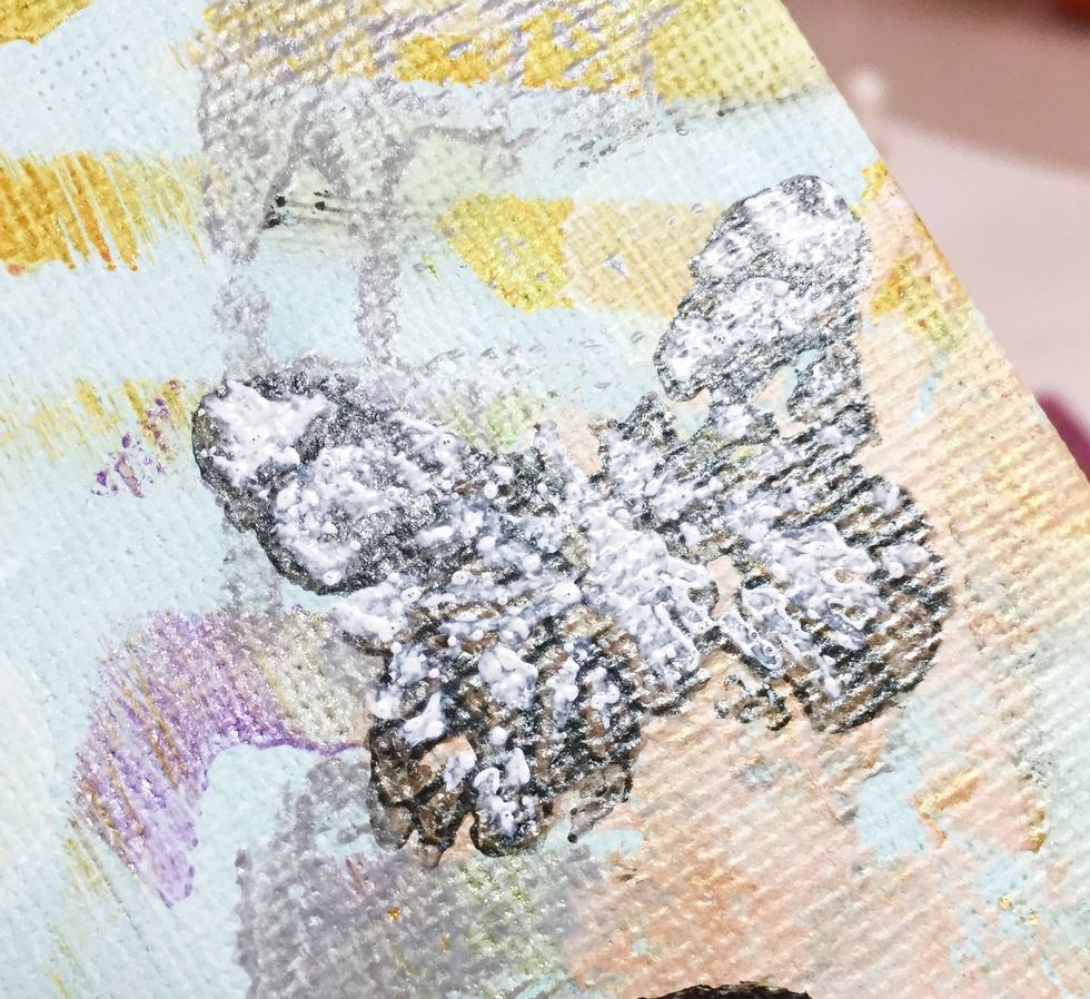 once dry, i mixed Jasmine and Opaline Izink and went over stenciled designs again.