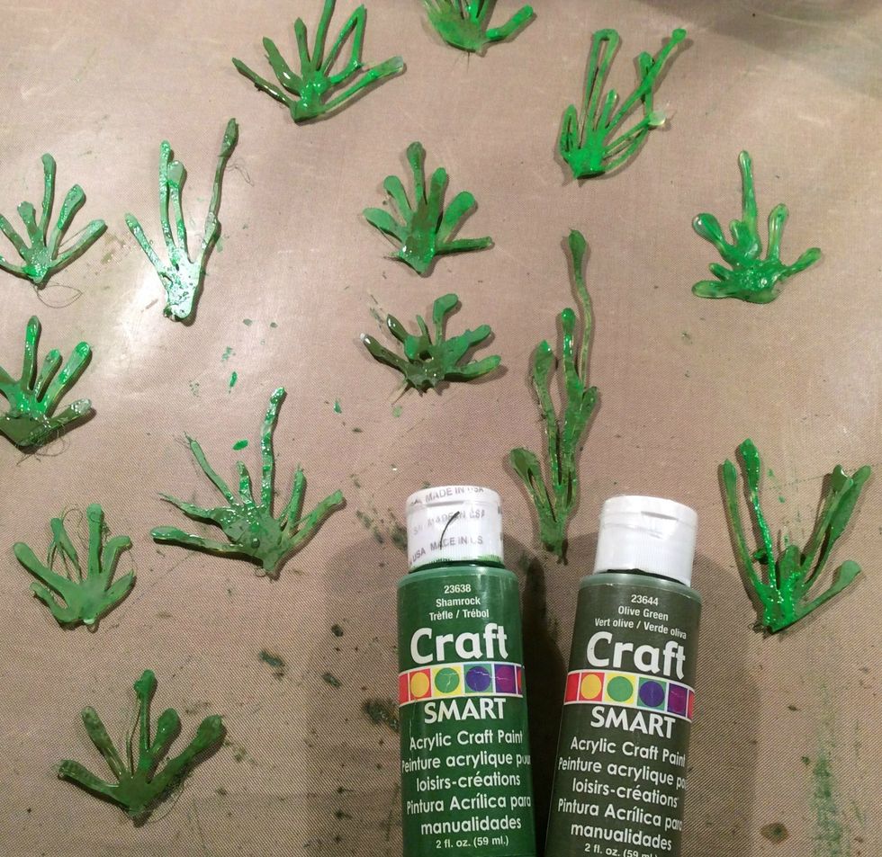 Once dry, turn your grass over and on the backside using different shades of green, paint your glue gun grass.