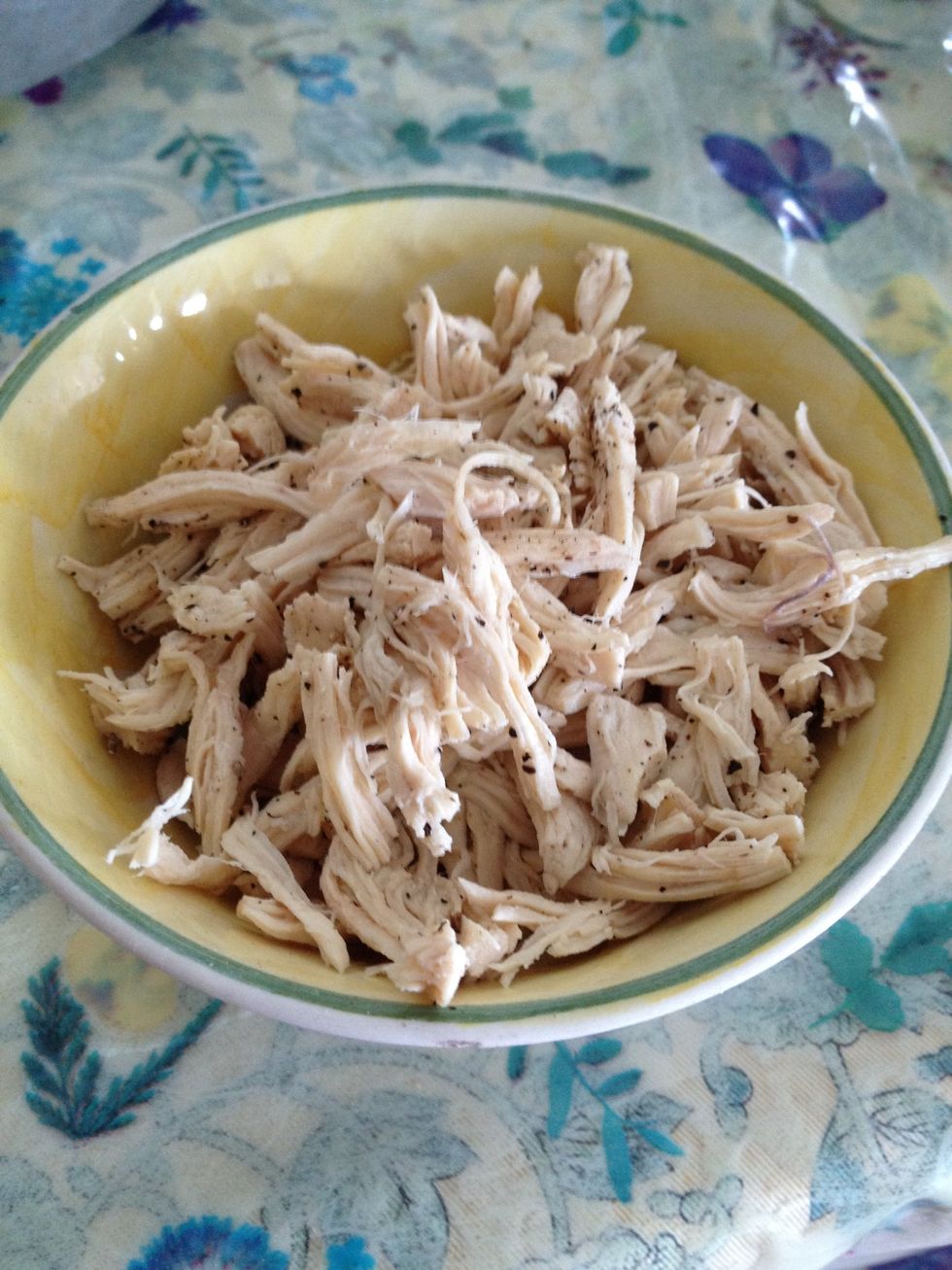 Once e chicken is boiled, shred it, sprinkle black pepper and toss it