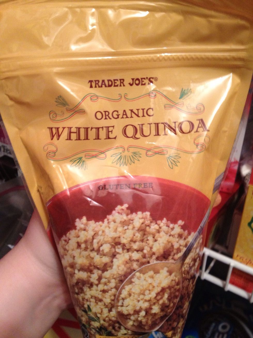 Once eggs are cooked through, add the quinoa to the pan and turn down to medium heat. Mix in with the eggs. Keep stirring throughout because the quinoa will soak up the excess oil then start to stick.