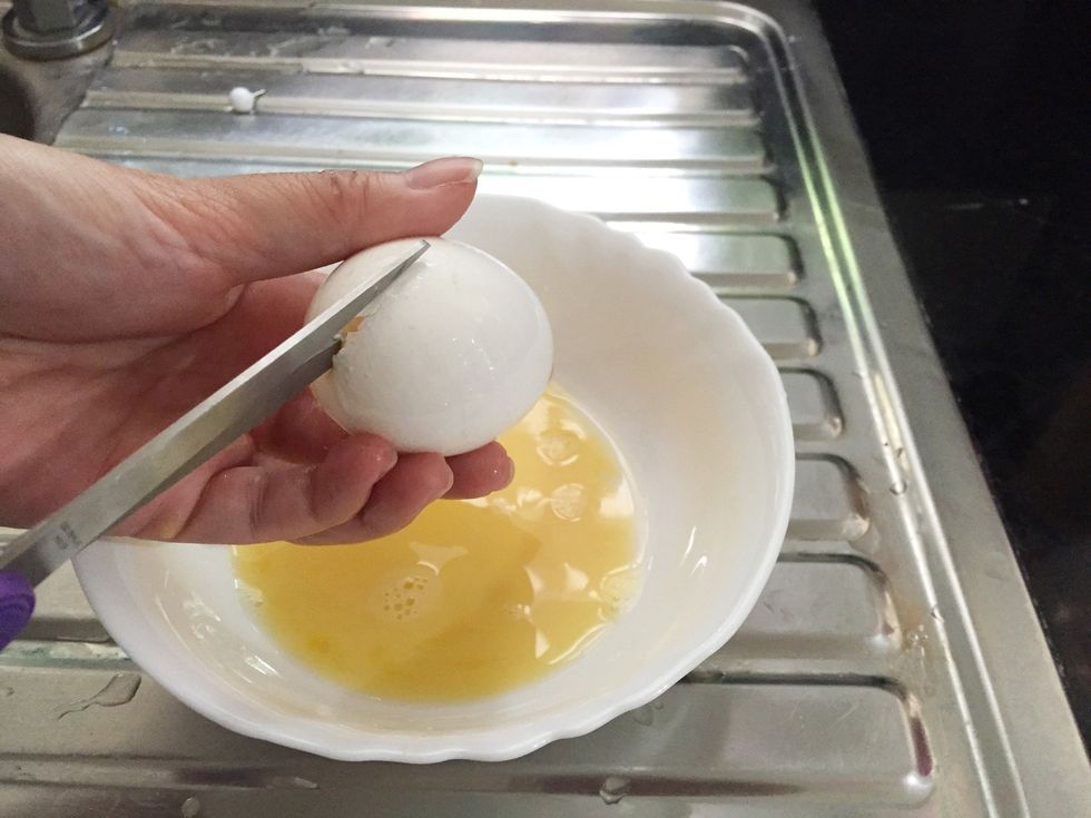 once empty, carefully cut the eggshell in half