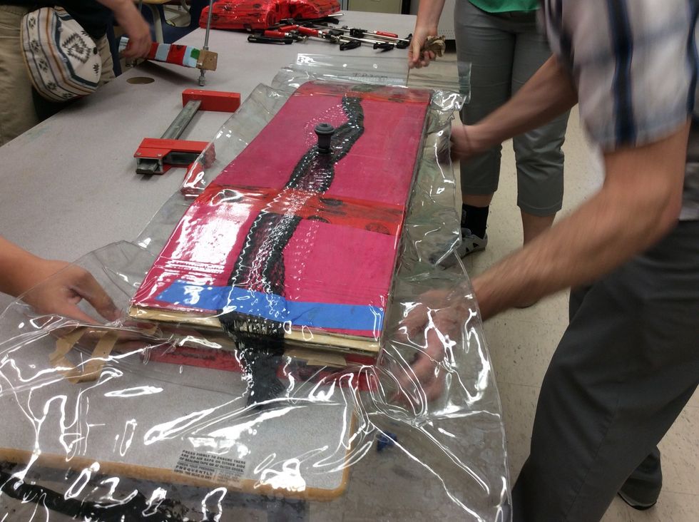 Once enough air has been taken out of the bag. Make sure to check to see if the bag was overlapped by the board. If so then gently pull the bag out so that it doesn't get damaged and continue pumping.