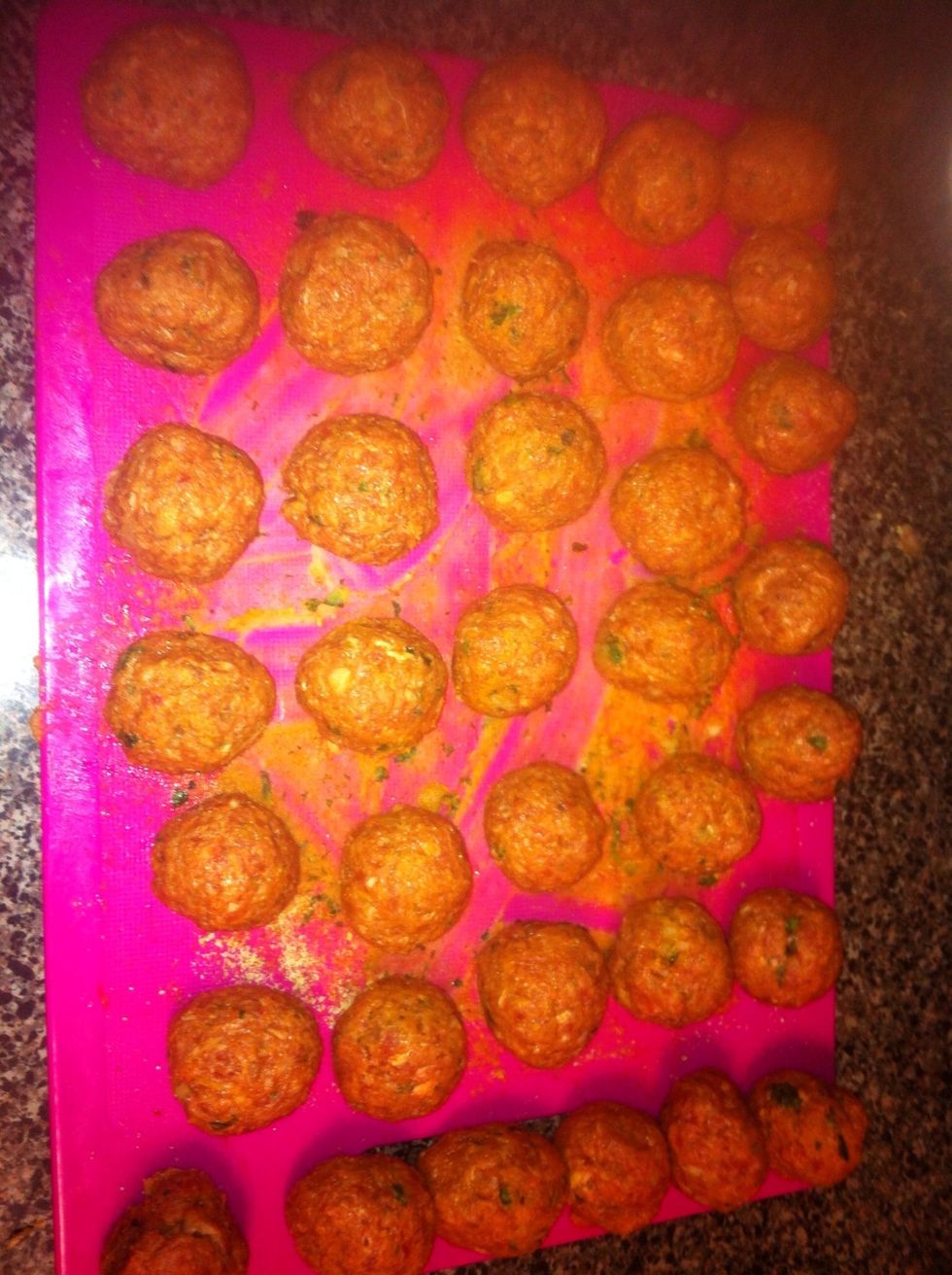 Once everything has been added to meat mixture, form your meatballs. I like to make them on the small size! Dredge them in flour and fry.