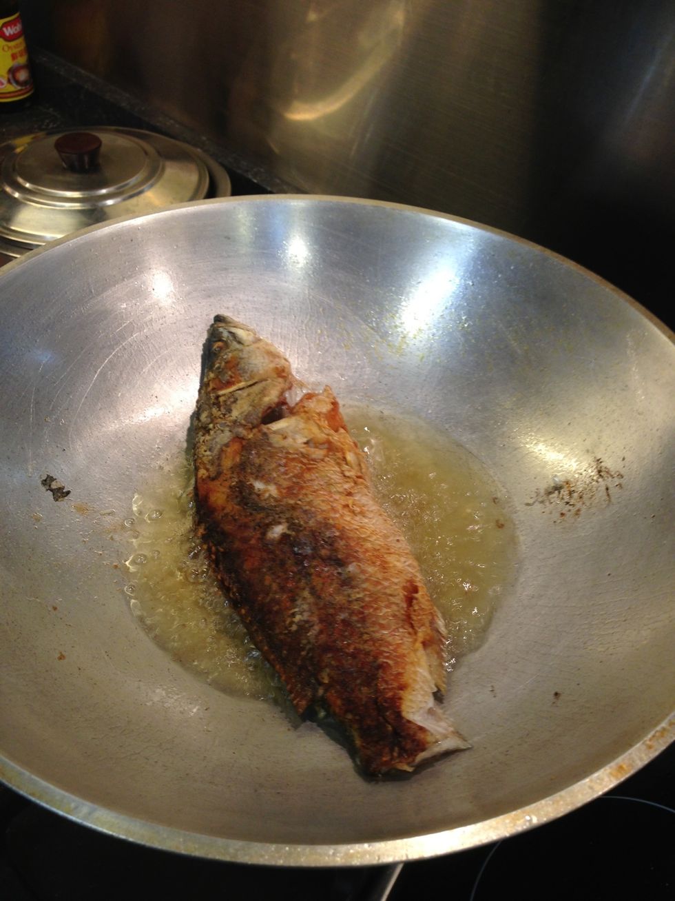 Once fish is nicely fried, remove from oil