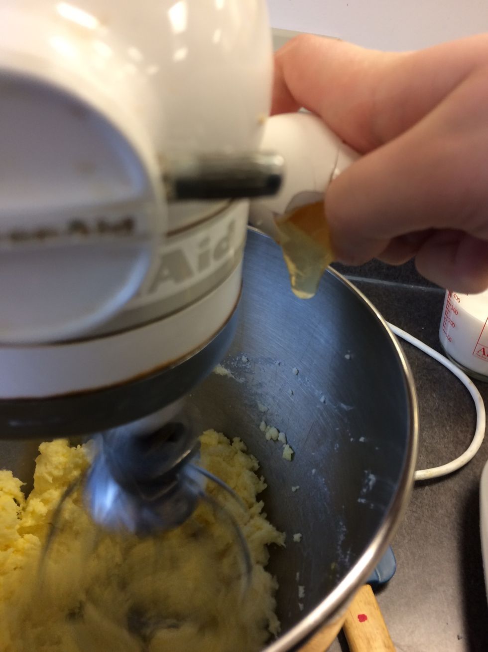 Once fluffy, add one egg at a time, beating well after each addition.