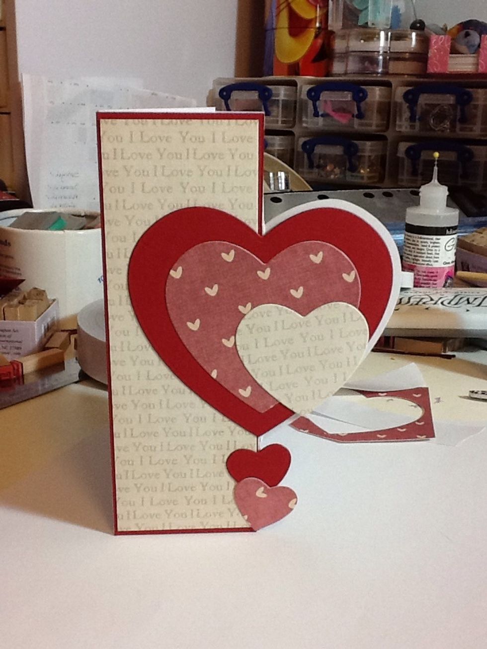 Once happy, stick down as shown!  Didn't get your layers on the left hand straight before (I never do!), then cut out two even smaller hearts, one in the card & one in the 2nd paper and stick as shown