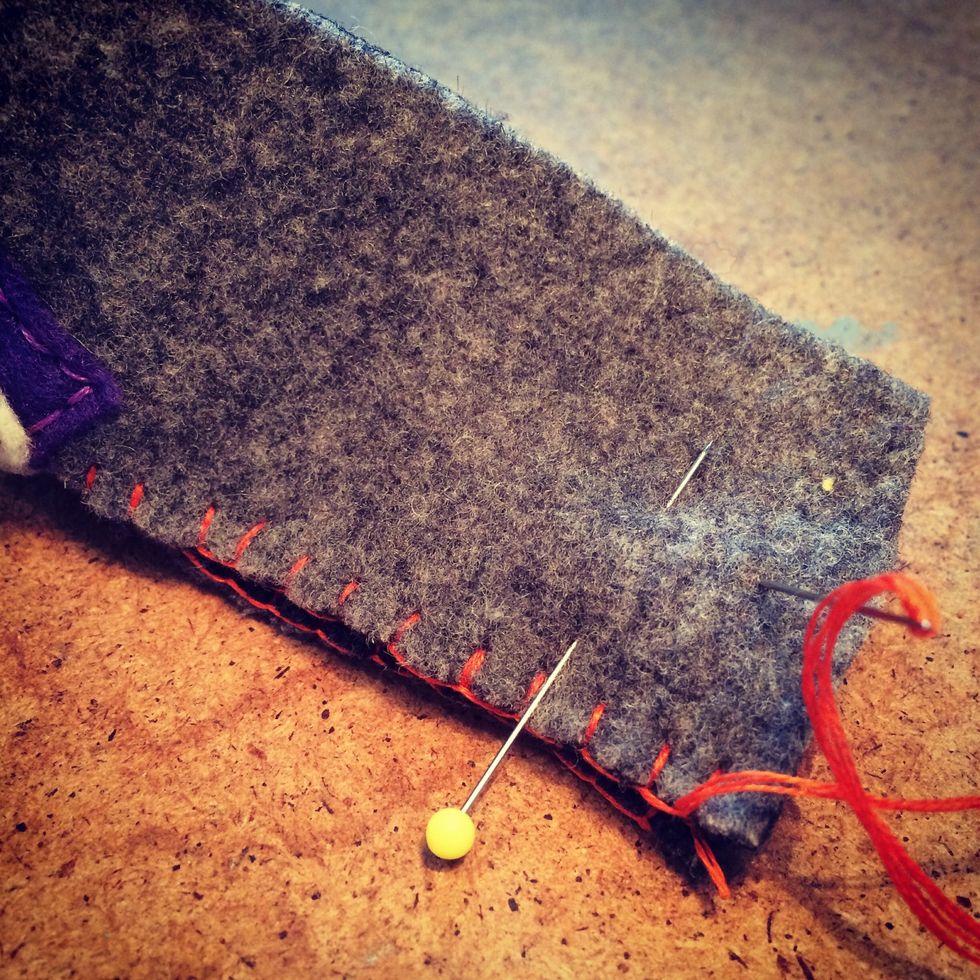 Once I've added the buttonhole stitch along the opening I'm ready to seal the back. Fold the bootie in half lining up the edges with the stitching then you can sew the back together.