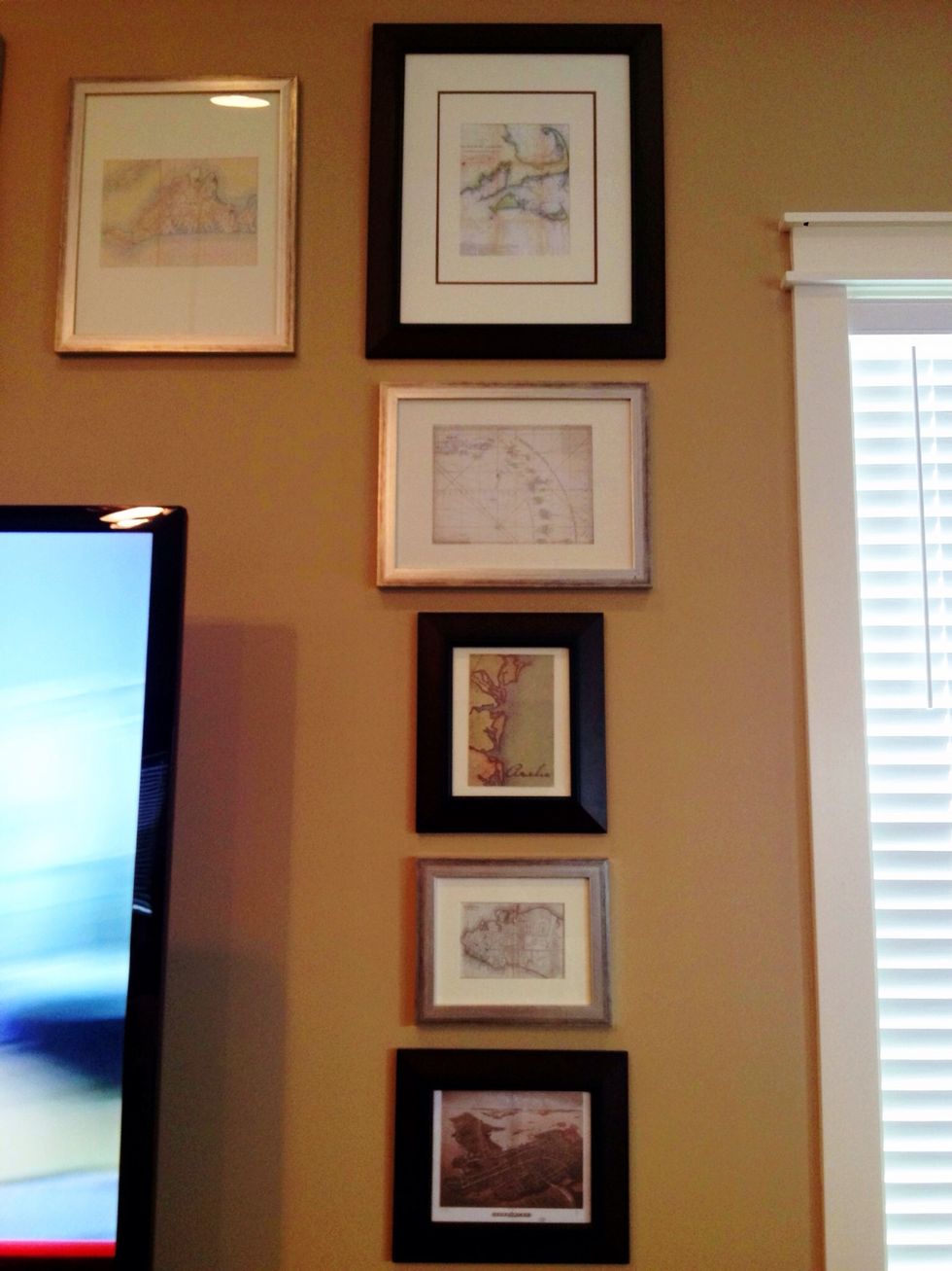 Once I was happy with the layout & spacing I applied command picture hanging strips to the back of my frames. Remove the paper square & replace with frame, press frame firmly against wall & voila!