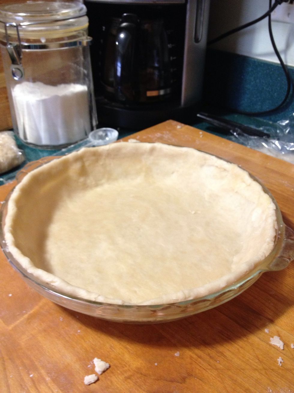 Once in the pie plate, trim the excess to the rim of the plate and fold the ~quarter inch of crust under the rest of the crust.