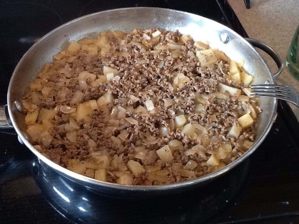 Once it all boils down, this is what you get! You can add more chili powder before you stir this, but it is not necessary. Look at those onions and how they browned up! The potatoes are perfect.