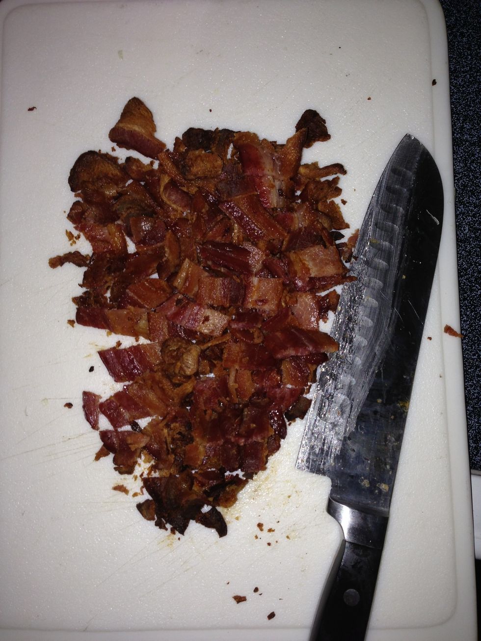 Once it cools, pat the bacon dry with a paper towel then cut up the bacon into smaller pieces.
