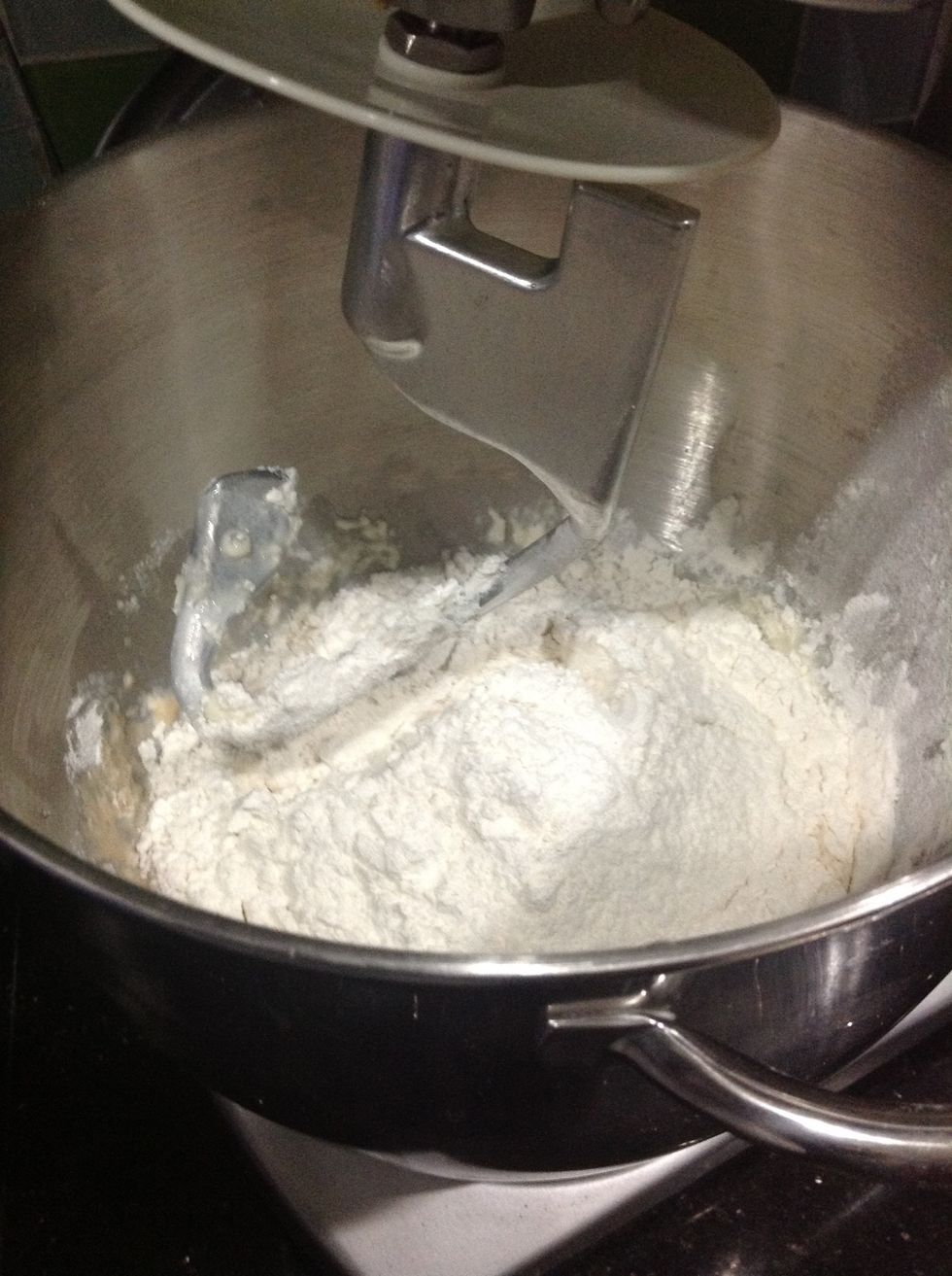 Once it gets disgusting and foamy, mix together the yeast mixture, milk, sugar, eggs, shortening (I used butter), and 2 cups of the flour.