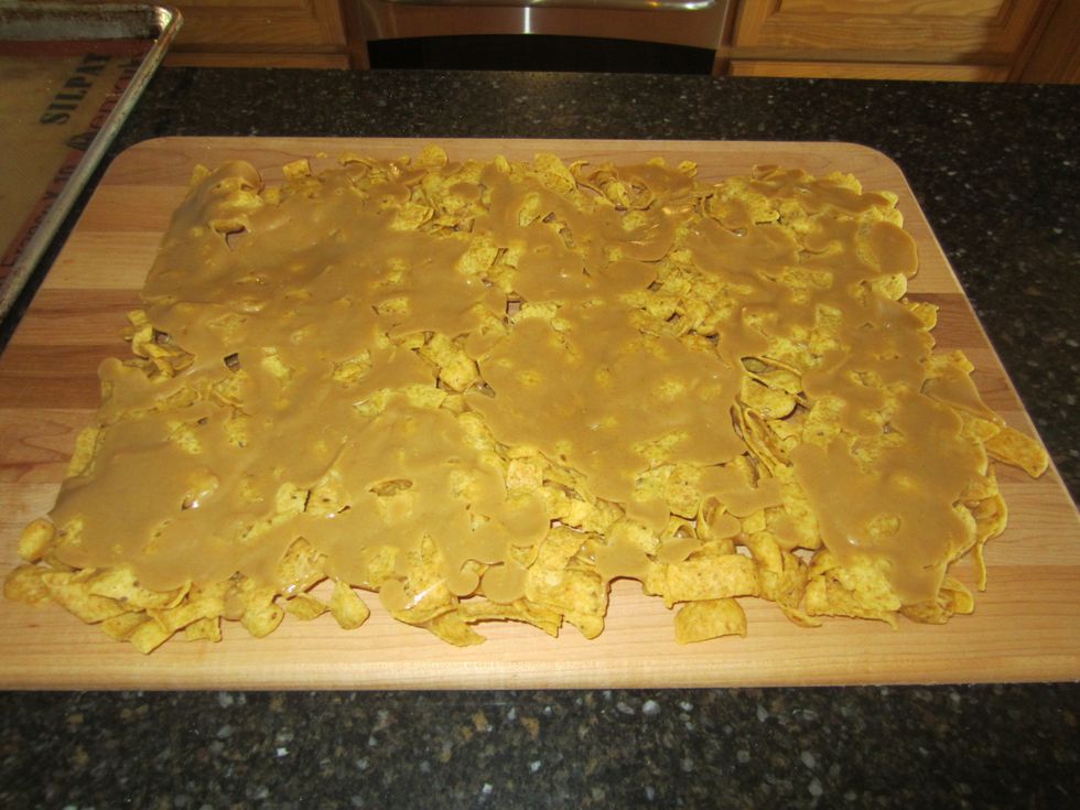 Once it has cooled and hardened you will need to dump it onto a cutting board if you used a silicone baking sheet. if you sprayed the cookie sheet with cooking spray instead you don't need to do this.