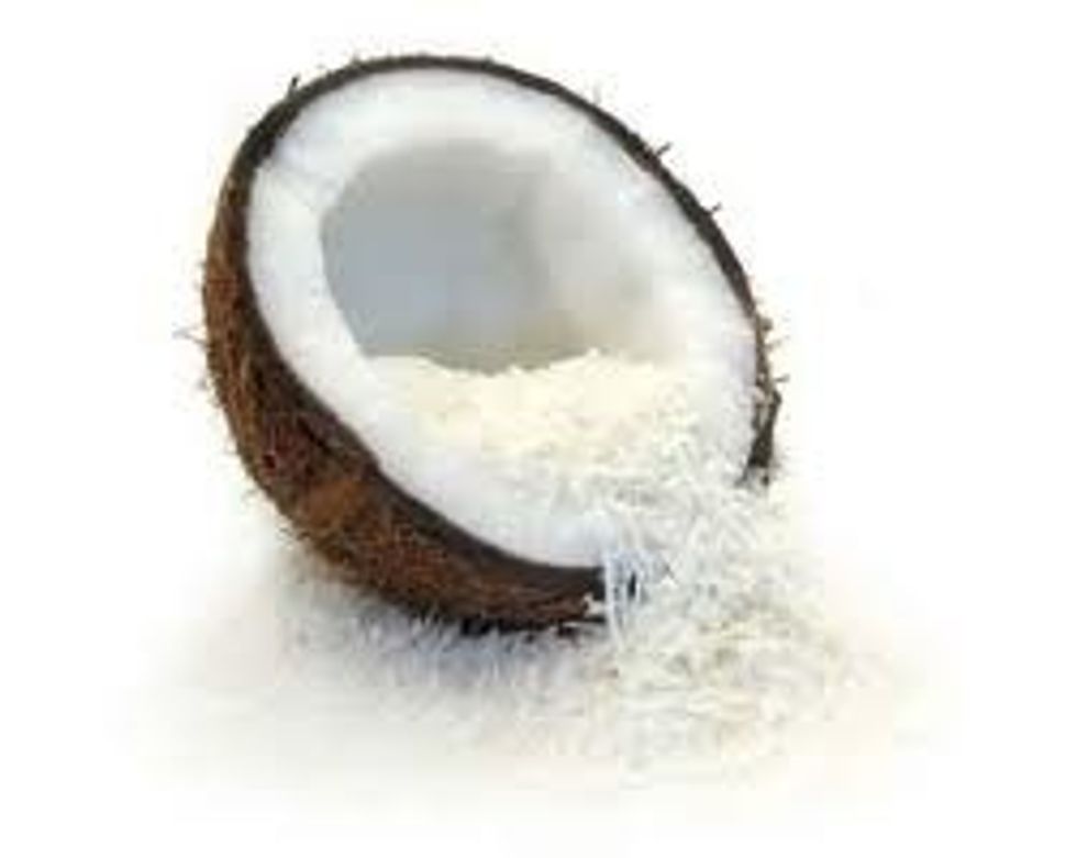 Once it has mixed properly roll in to small balls then roll in coconut