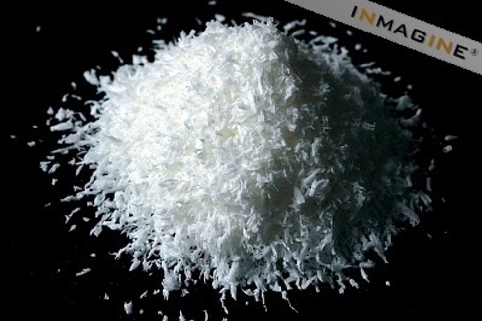 Once it has mixed properly roll it in to tiny balls then roll in coconut