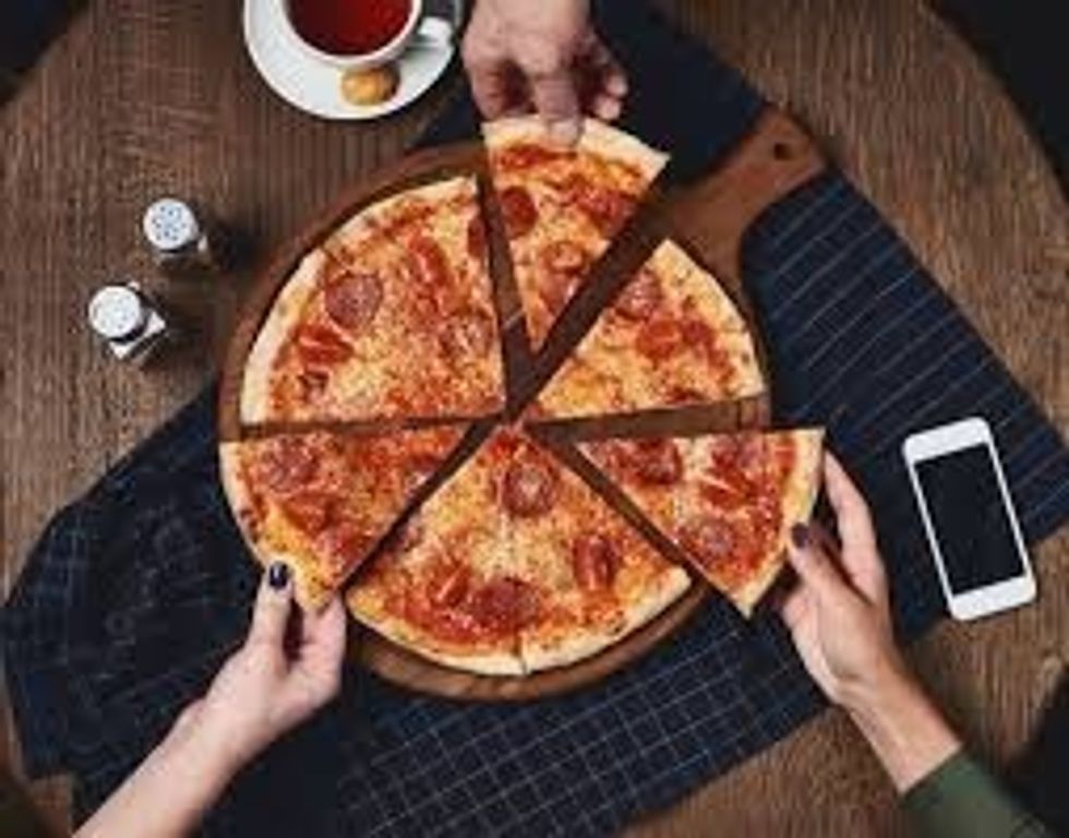 Once it is back on the plate invite your friends over give all of them a plate that has a slice of pizza on it after they eat it ask them if they like it {they will say yes.}