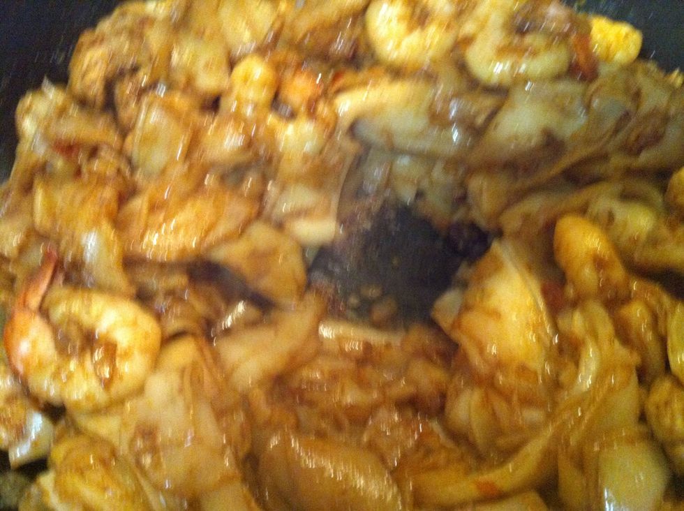 Once it is cooked and all the sauce is mixed through - make a little well at the centre of the wok.