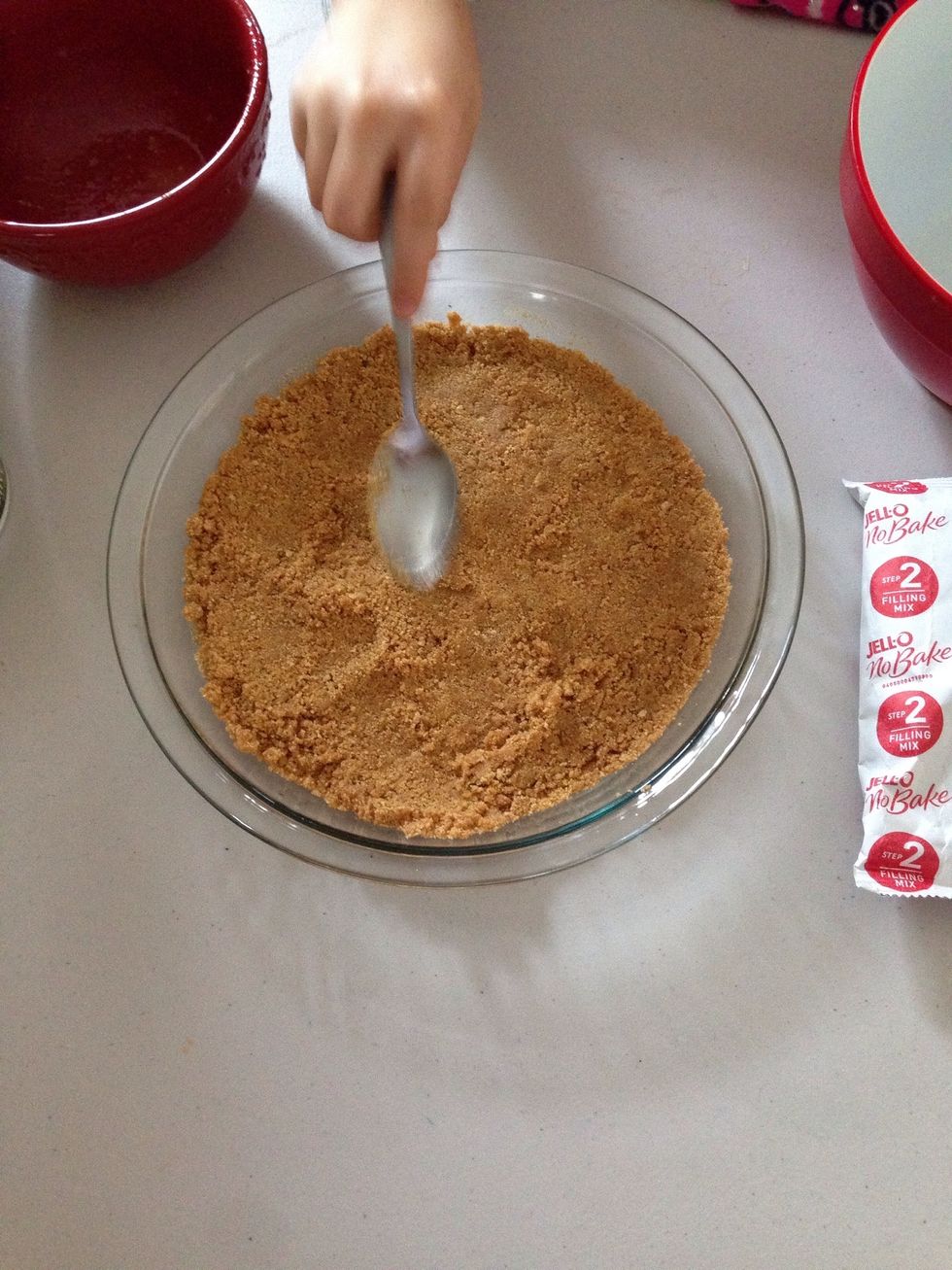 Once it's all mixed, pat it down with a spoon and pack it down gently and evenly. It should look like this.