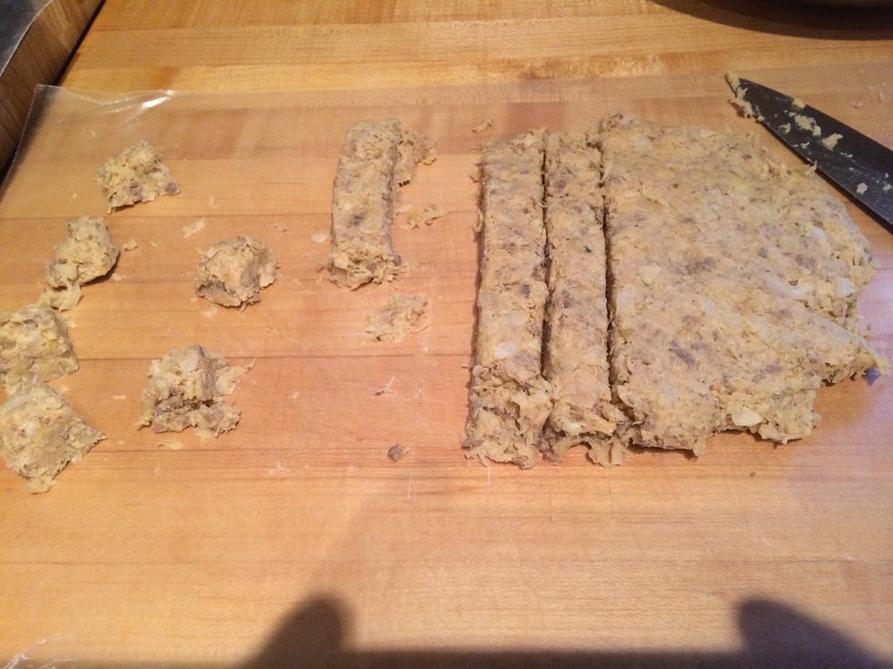 Once it's cooled down, roll out the mixture to about 3/4-1inch thickness. Then start cutting into strips of about 1 inch.