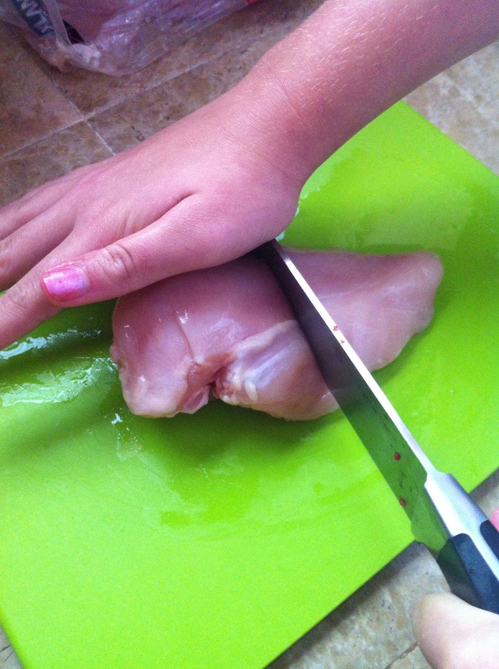 Once it's defrosted, cut your chicken breast in half...