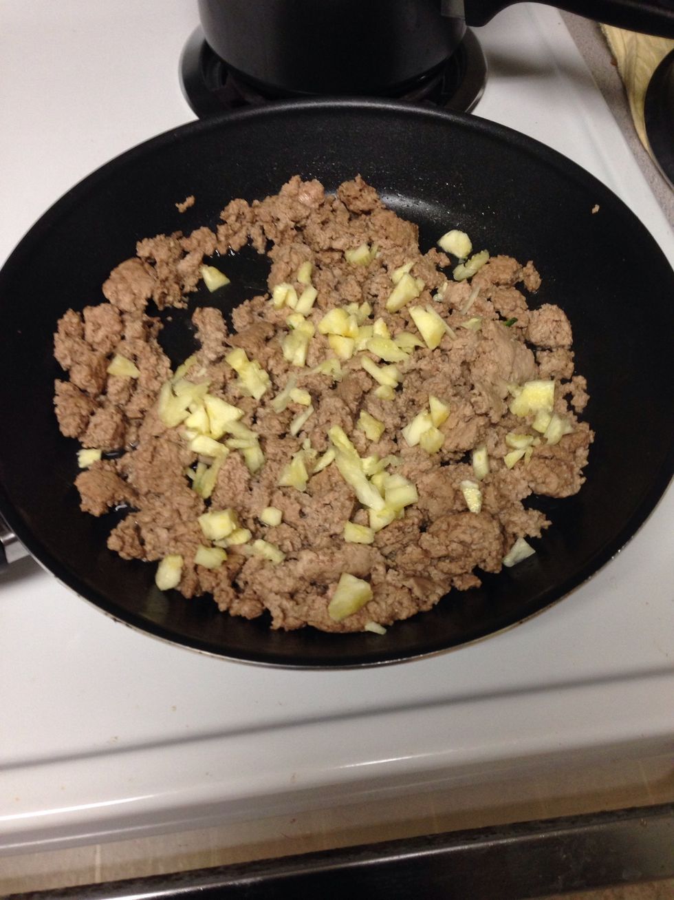 once it's drained, add chopped zucchini seeds to meat
