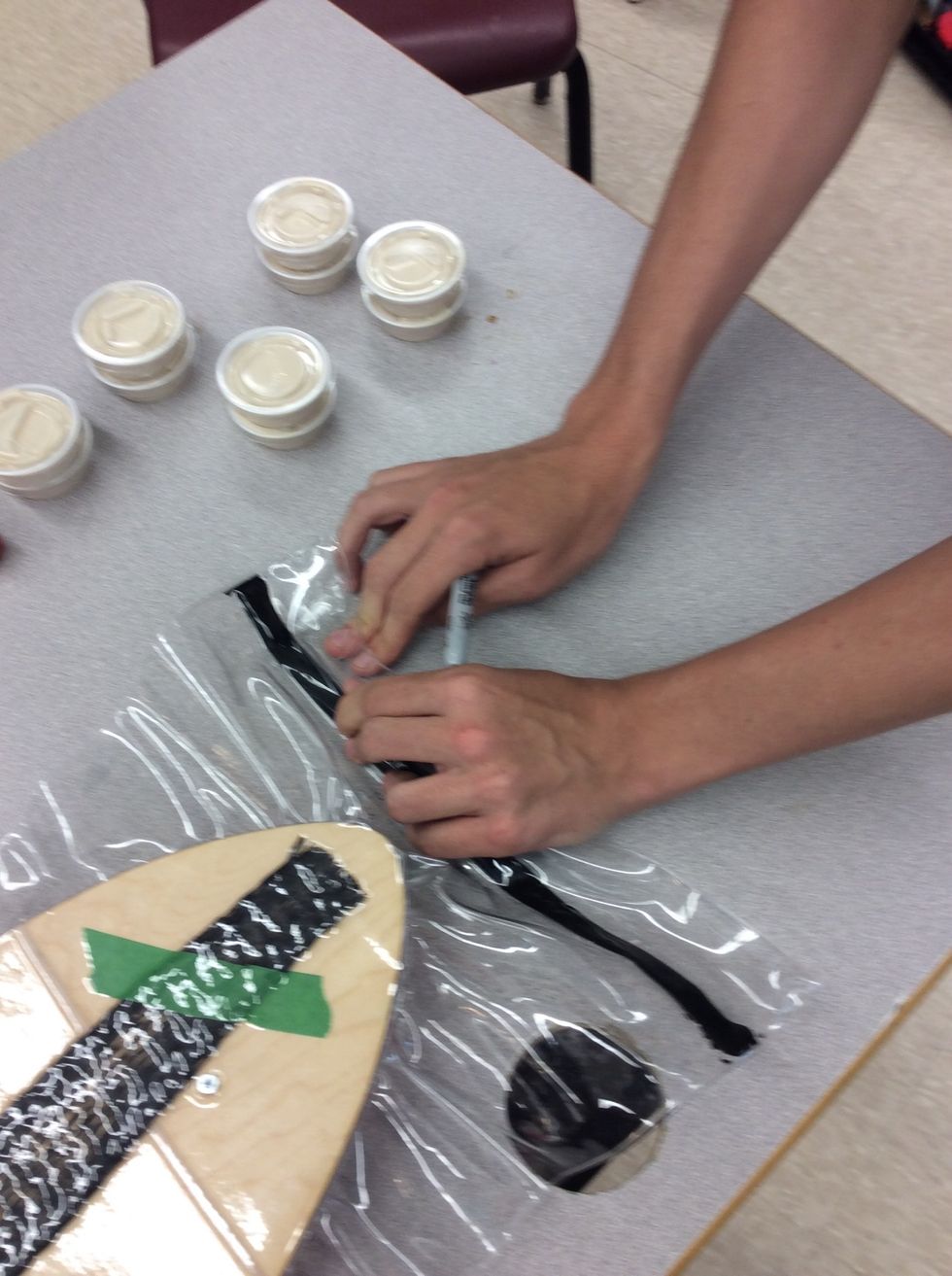 Once it's in with the mould underneath the board inside the bag with the board then seal the bag by pressing on the tar but don't press too hard just make it change colour