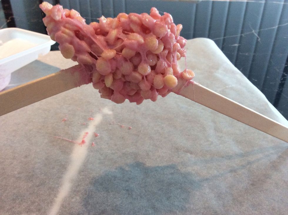 Once it's mixed, scrape it out of the tray and start spinning it around with the sticks. Spin, spin and twist it over and over itself. Just have fun.