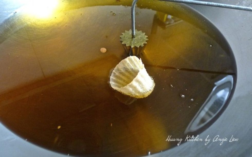 Once it's off the mold, deep fry in the oil until it turns light golden brown in colour.