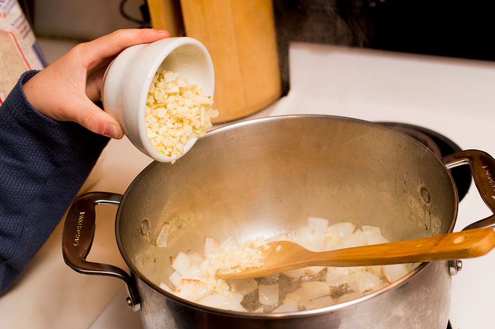 Once it's steaming, add the garlic.