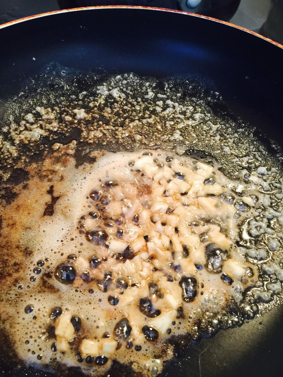 Once it turns brown add your garlic