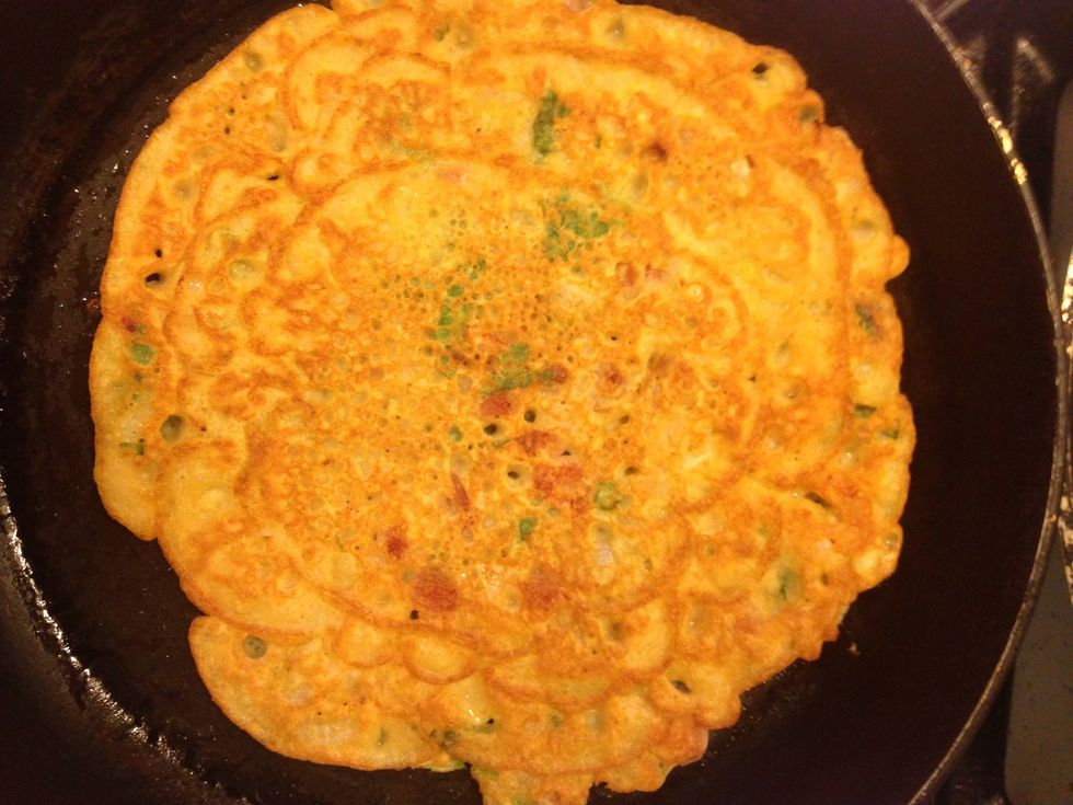 Once light golden brown on the bottom, flip over. Once again cover and allow to cook on medium heat.