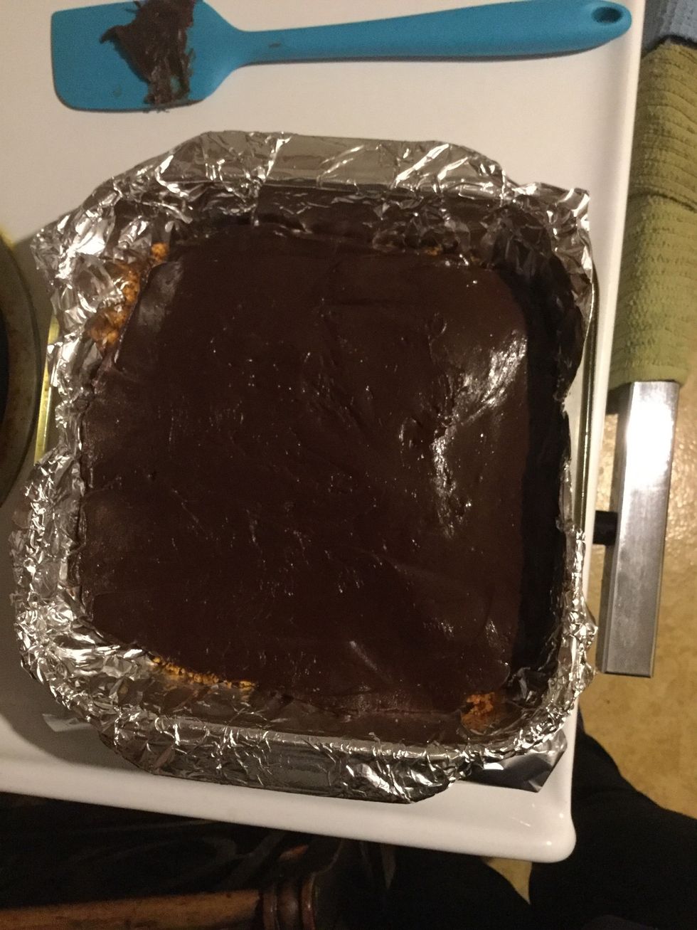Once melted pour the chocolate over the graham cracker and put in the fridge for about ten minutes to cool