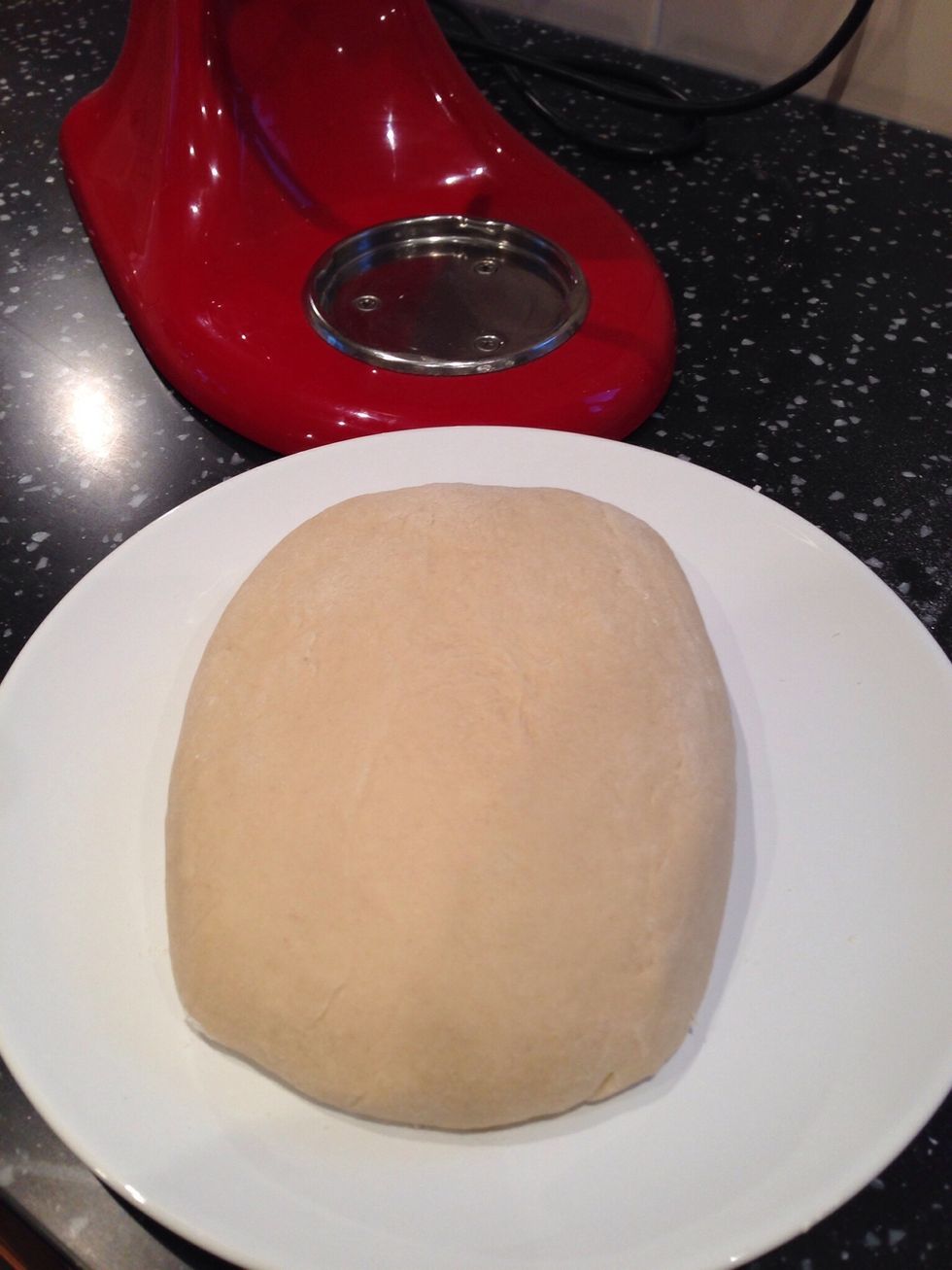 Once mixed tip the dough onto a floured plate and shape into a rough square. Flatten slightly and cover with cling film. Place in the refrigerator for 2 hours