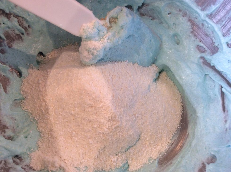 Once mixture is ready slowly start adding in the almond meal and icing sugar mixture, and gently fold in with a spatula. (3-5 minutes)