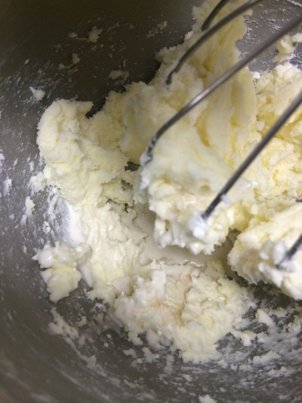 Once no lumps remain, pour the vanilla and whipping cream mixture into the Kitchen Aid. Change from the whisk attachment to the flat beater bar attachment and beat until fluffy and smooth.