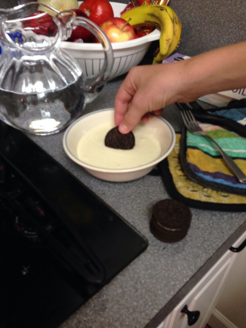 once oil comes to a boil, begin dipping Oreos in pancake mix