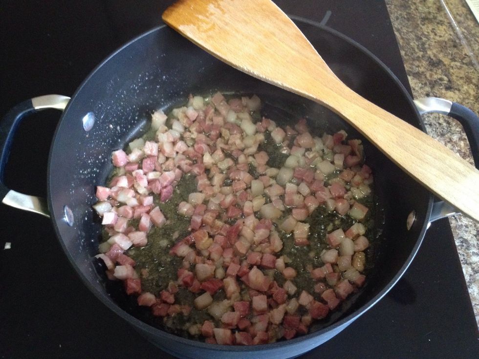 Once oil is heated up, add 8 oz of diced pancetta. Cook until golden and crisp, usually about 5-6 mins.