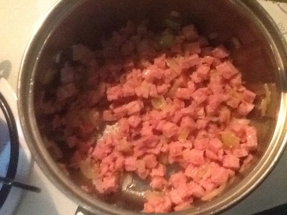 Once onion has softened add bacon and cook until it has slightly browned