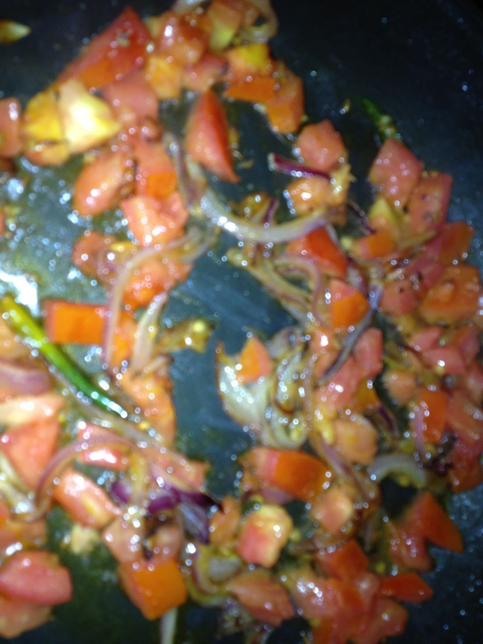 Once onions are soft add chopped tomatoes and saut\u00e9 for around 3 mins