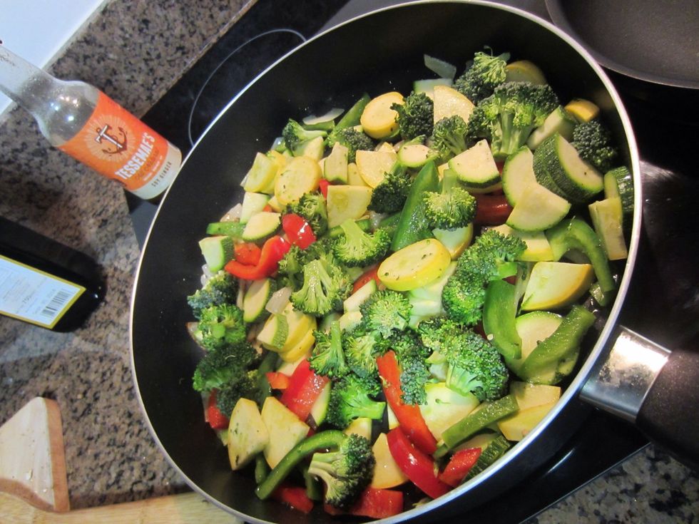Once onions are translucent add the rest of the veggies. Pour on Soy Ginger loosely.