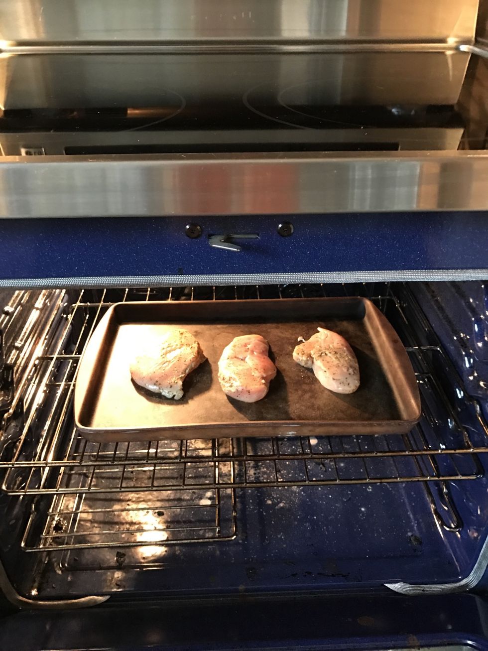 Once oven is heated, place chicken in the oven