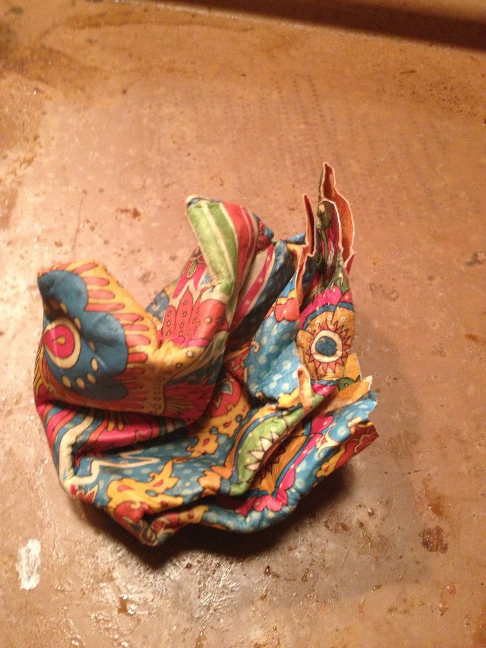 once paper is very damp, crumple into a ball.