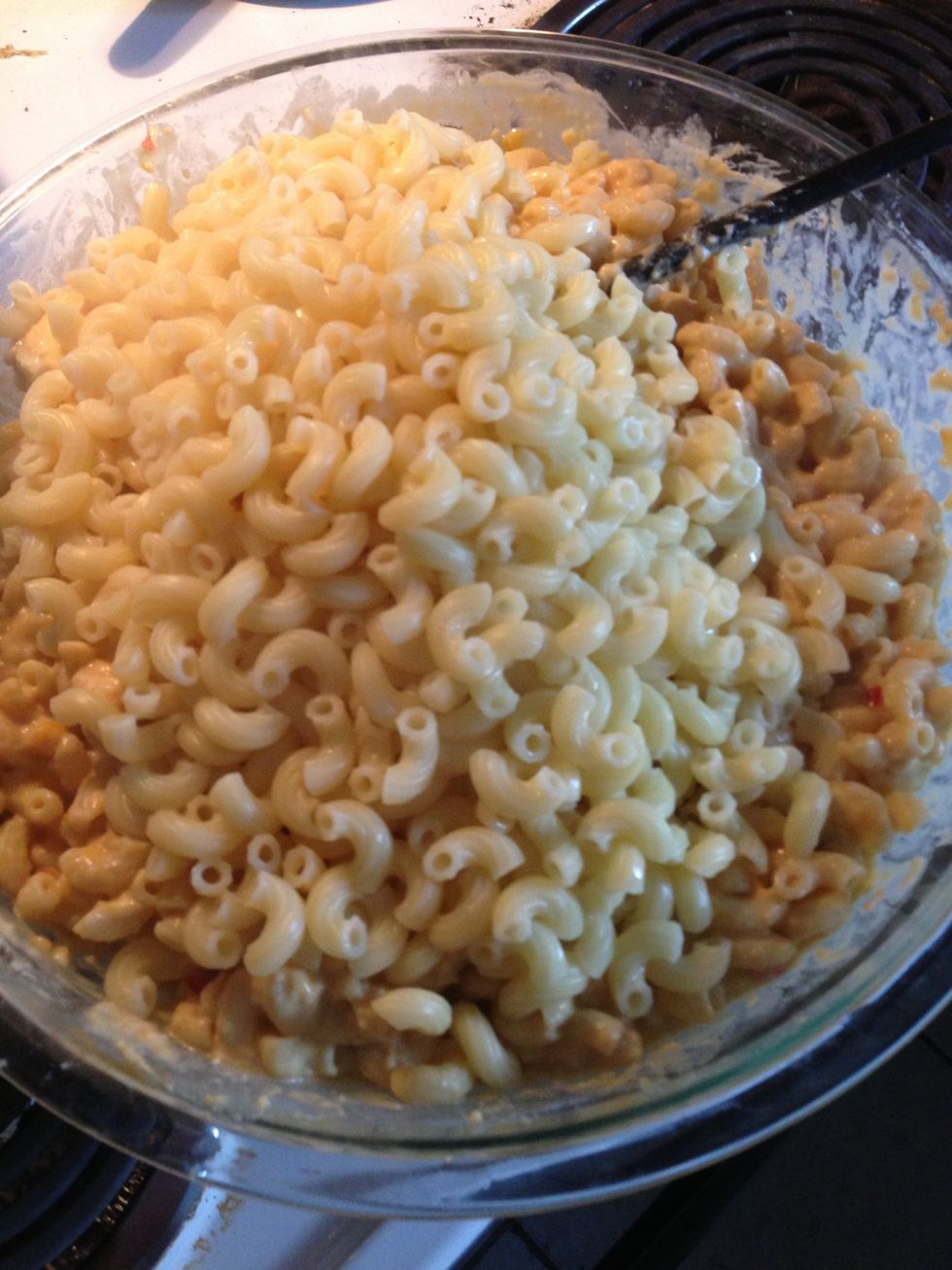 Once pasta is cooked, add the pasta. It's ok if pasta water gets into the mix.