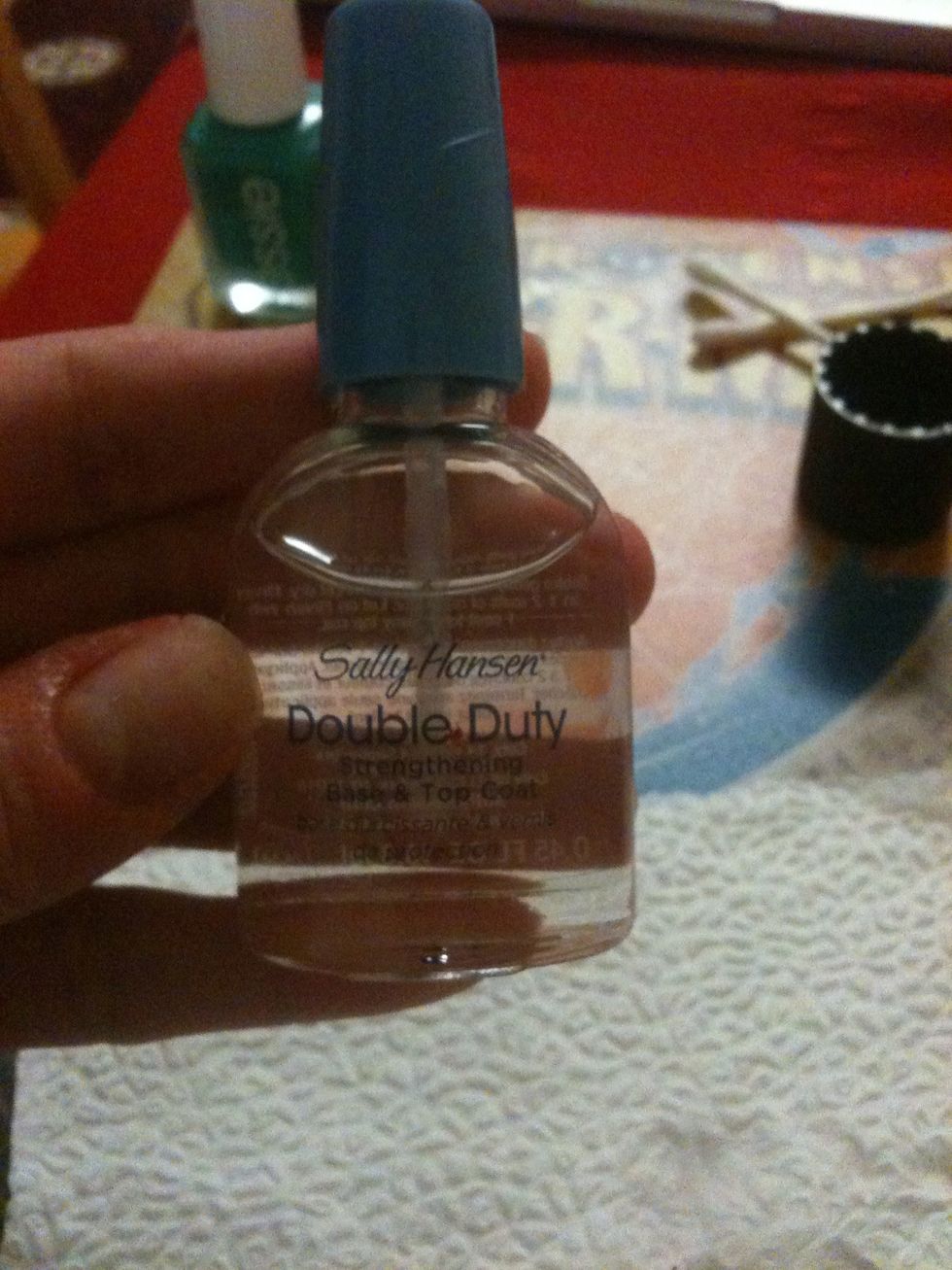 Once polish is off. Brush one coat of the base on. I'm using double duty by Sally Hansen. It's a base and top coat. And it strengthens the nails