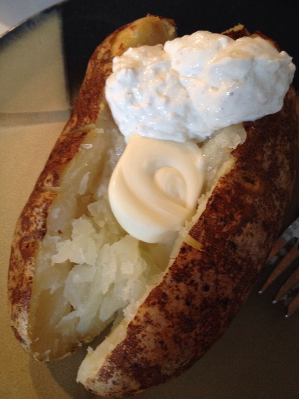 Once potatoes are cooked, slice down the center and fluff the insides. Add some butter and Doxy's Natural Onion Dip.